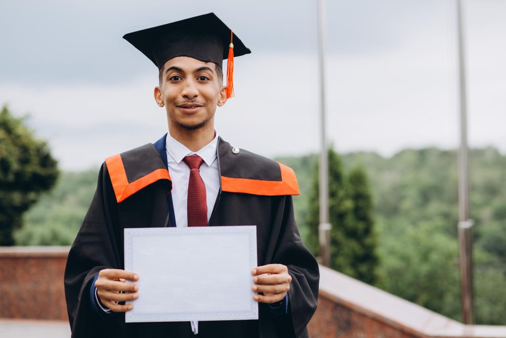 man holding Australian degree
