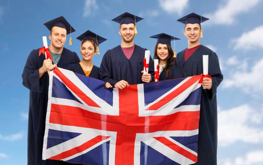 Graduate students with diplomas and british flag